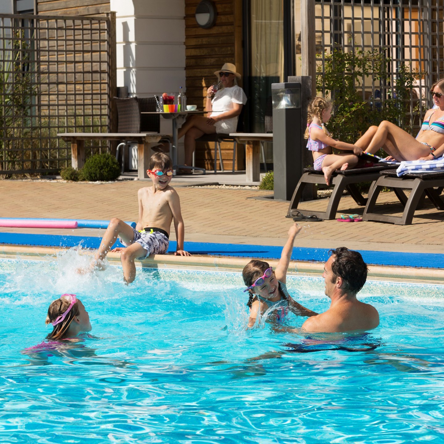 Family enjoying the outdoor pool