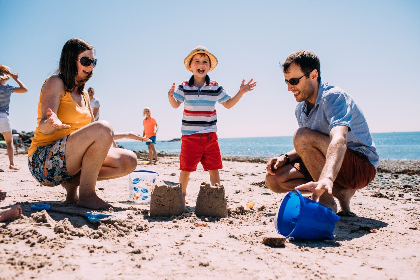 Family building sandcastles