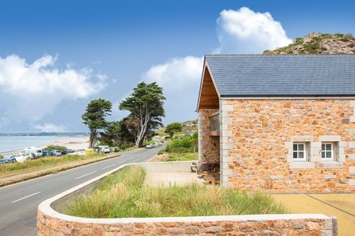 Exterior of cottage next to main road